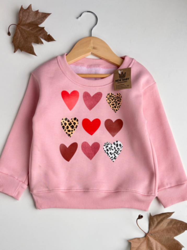 Buzo rosa corazones