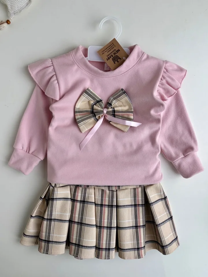 Conjunto bucito rosa y pollera
