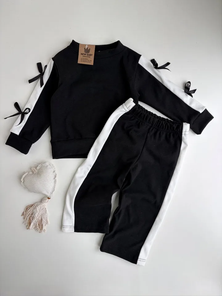 Conjunto darlon negro con moñitos