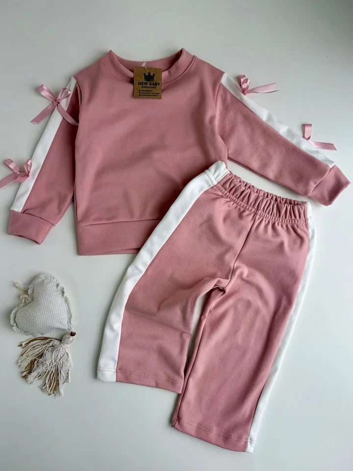 Conjunto darlon rosa con moñitos 