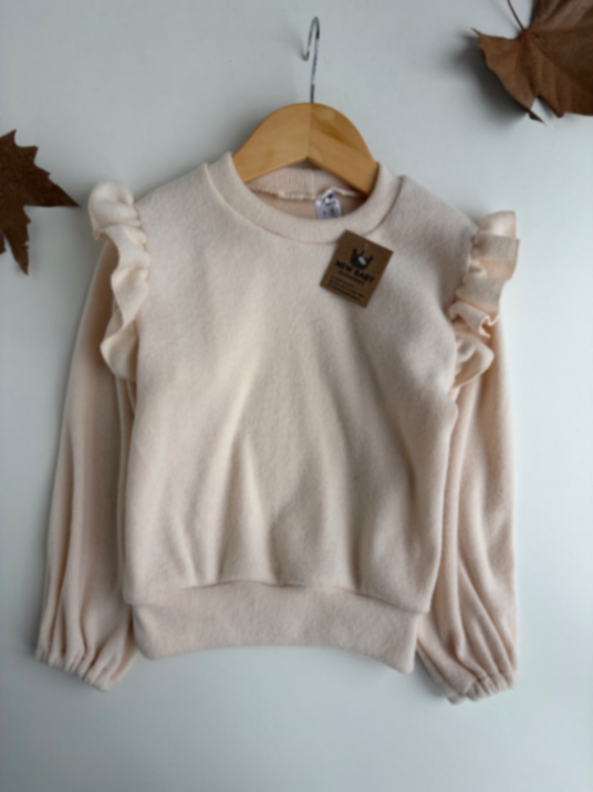 Sweter natural con volados